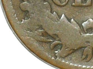 1878 Indian Head Penny CUD-001 die break showing raised cud blob at lower-left obverse rim between 6:30 and 7:30 o'clock